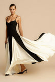 FJØRNA Griselda color block maxi slip dress in black, featuring a flowing design and sleeveless silhouette on a model.