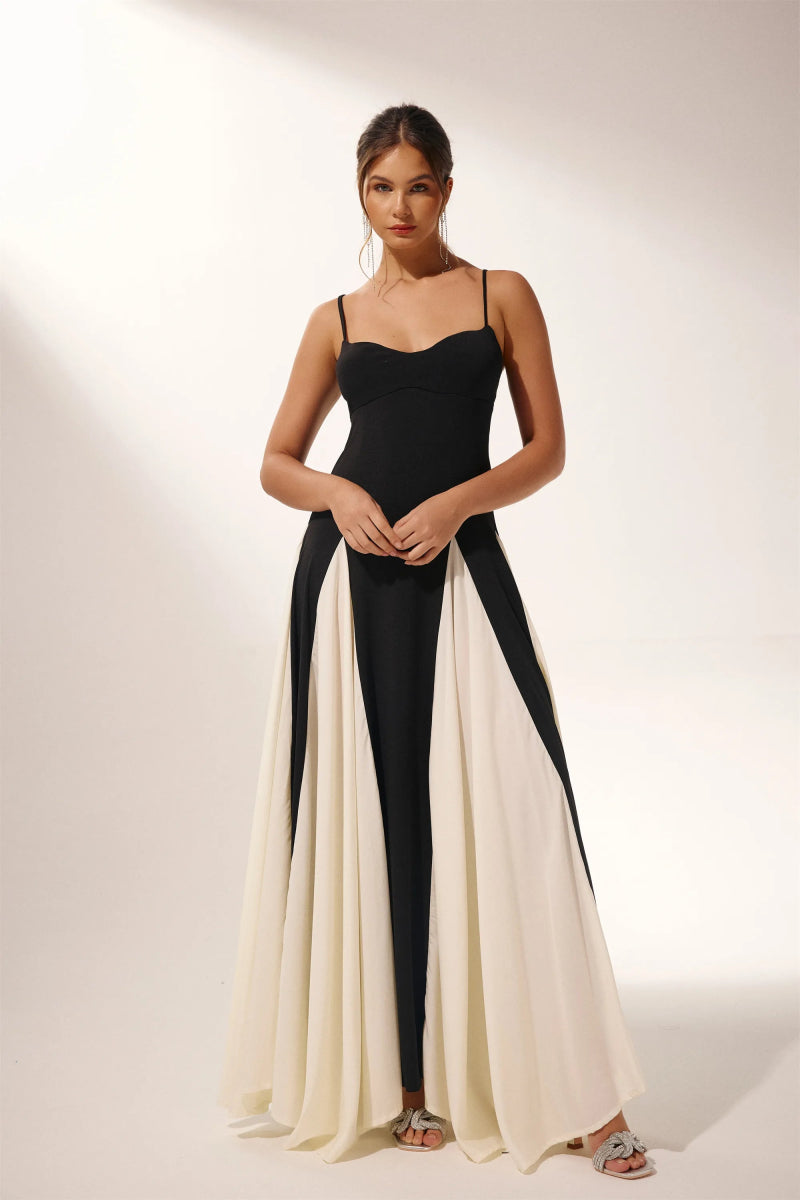 FJØRNA Griselda color block maxi slip dress in black, featuring a flowing silhouette and bold color blocking design.