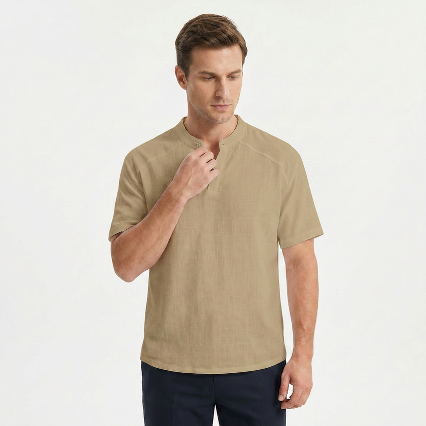 FJØRNA men's tan linen short sleeve Henley T-shirt with a collar, shown adjusting the collar on a plain background.