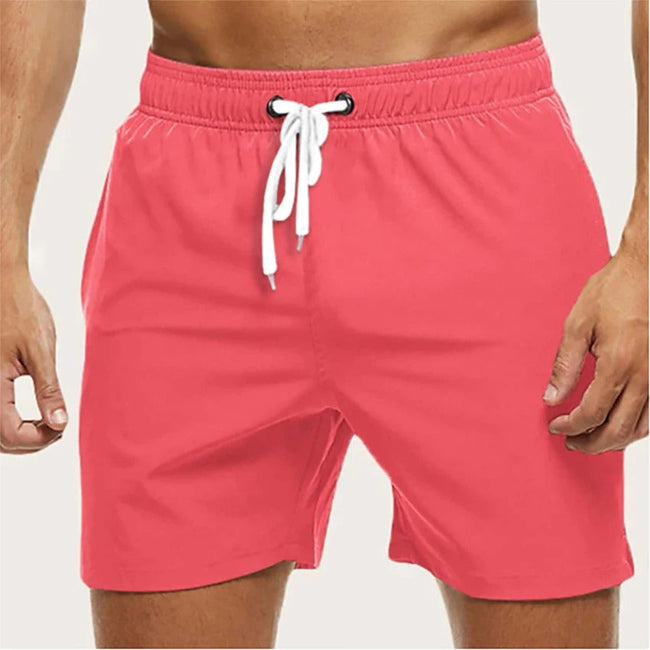 Men's FJØRNA quick-dry swim shorts with elastic waist, featuring a lightweight, breathable design for comfortable beach wear.