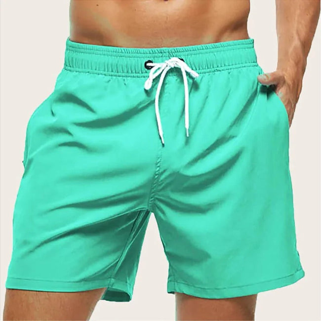 Men's quick-dry swim shorts with elastic waist by FJØRNA, featuring a stylish design for beach and pool activities.