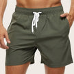 Men's quick-dry swim shorts with elastic waistband from FJØRNA, shown in a stylish design for beach and pool wear.