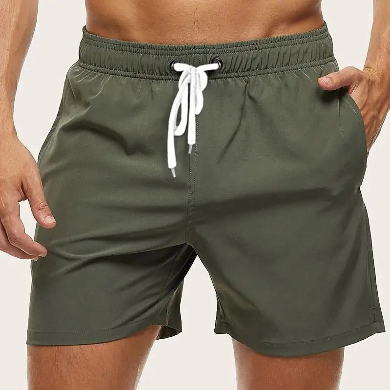 Men's quick-dry swim shorts with elastic waistband from FJØRNA, shown in a stylish design for beach and pool wear.
