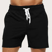 Men's quick-dry swim shorts by FJØRNA with elastic waistband, perfect for beach and pool swimming, shown in a relaxed fit.
