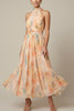 FJØRNA women's floral halter neck maxi dress with tie back, full-body view, suitable for wedding guests.