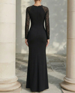 FJØRNA sheer sleeve sculpted floor-length evening dress with fitted bodice and flowing skirt, perfect for formal occasions