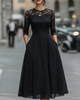 Elegant lace bodice dress with soft flowing skirt for women, by FJØRNA, showcasing intricate lace details and a graceful silhouette.