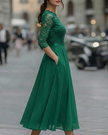 FJØRNA elegant lace bodice dress with soft flowing skirt, perfect for women, showcasing intricate lace details and a graceful silhouette.