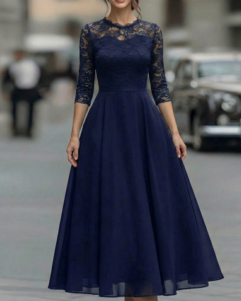 FJØRNA elegant lace bodice dress with soft flowing skirt, perfect for women’s formal or special occasions.