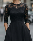 FJØRNA elegant lace bodice dress with soft flowing skirt, perfect for women, showcasing intricate lace details and a graceful silhouette.