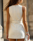 FJØRNA chic faux leather belted mini dress, stylish dress with a fitted silhouette, featuring a waist belt and sleek leather-like fabric.