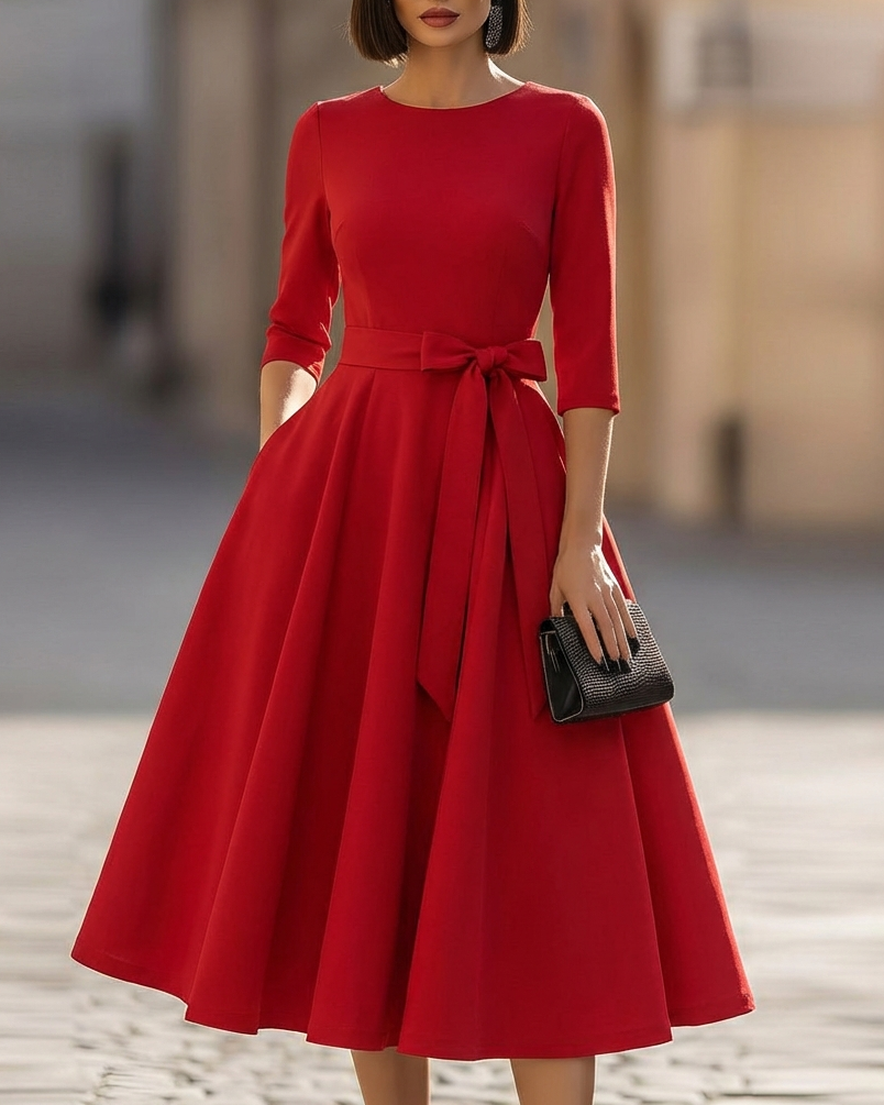 FJØRNA crew-neck midi dress for women, showcasing a stylish, knee-length dress with a fitted bodice and soft fabric.