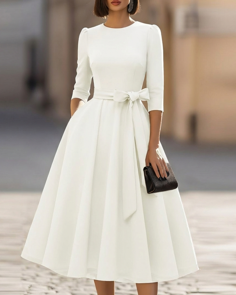 FJØRNA crew-neck midi dress for women, stylish and comfortable knee-length dress with a fitted top and flowing skirt.