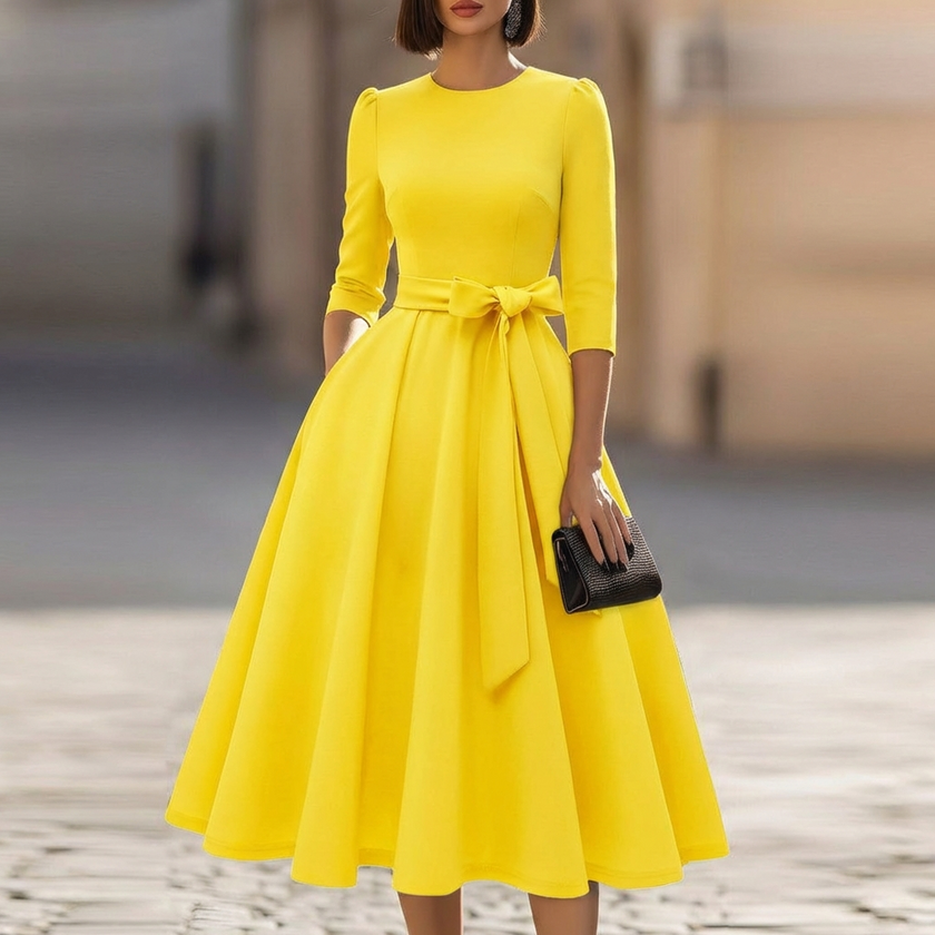 FJØRNA crew-neck midi dress for women, featuring a sleek, fitted design with long sleeves and a midi length in soft fabric.