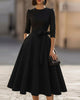 FJØRNA crew-neck midi dress for women, light fabric, knee-length with a fitted waist and short sleeves, displayed on a mannequin.