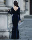 FJØRNA velvet square-neck long-sleeve mermaid dress for women, shown in deep red with fitted silhouette and elegant design.
