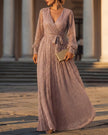 FJØRNA shimmering long-sleeve V-neck wrap evening gown with a flowing maxi dress and elegant sleeves, perfect for formal occasions.
