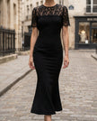 FJØRNA lace sleeve fitted midi dress for women, showcasing a sleek silhouette with intricate lace details and long fitted sleeves.