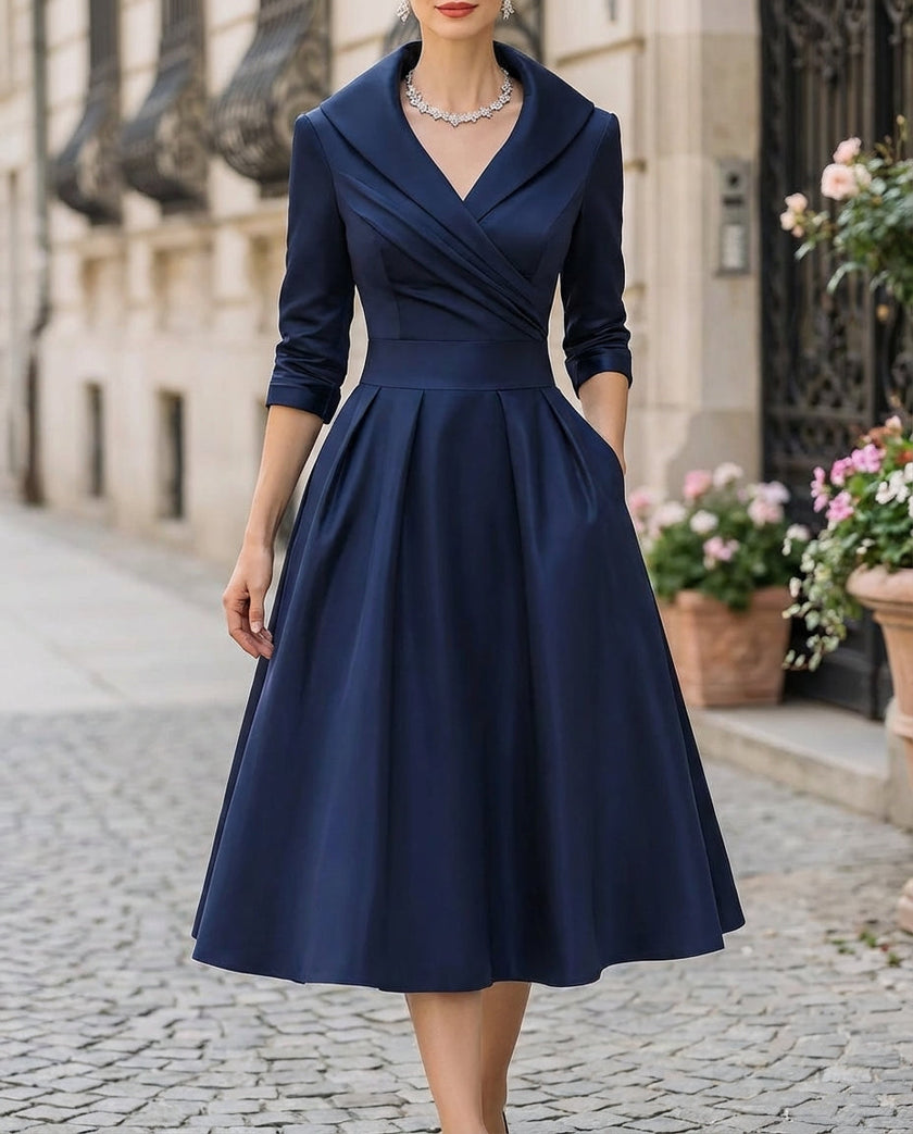 FJØRNA satin midi dress with trench collar, waist-defining band, long sleeves, and elegant wrap design.