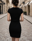 FJØRNA refined v-neck cap-sleeve pencil midi dress for women, shown in a sleek, fitted style perfect for elegant occasions.
