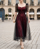 FJØRNA sheer puff-sleeve lace A-line midi dress featuring delicate lace fabric and elegant puff sleeves, full-length on model.