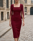 FJØRNA elegant square-neck midi cocktail dress with slit sleeves, perfect for women’s formal occasions, shown in black fabric.