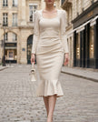 White pearl-trim square-neck mermaid midi dress for women by FJØRNA, showcasing fitted silhouette and elegant design.