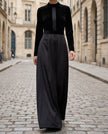 Elegant black velvet and satin midi dress for women by FJØRNA, featuring a sleek, fitted design with a sophisticated drape.