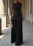 FJØRNA elegant sleeveless pleated maxi dress for women, flowing fabric with a fitted waist and stylish design.