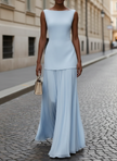 Elegant FJØRNA sleeveless pleated maxi dress for women, flowing fabric with a fitted bodice and full-length skirt.