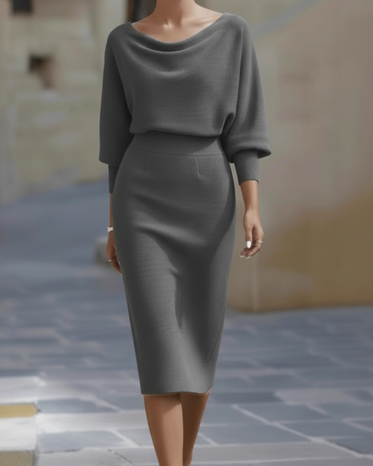 FJØRNA draped cowl neck midi dress for women with three-quarter sleeves, featuring a flowing silhouette and elegant design.