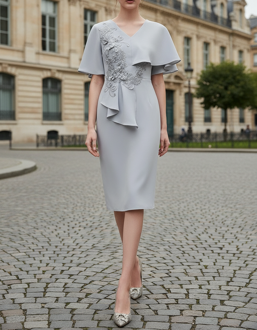 Elegant FJØRNA embellished cape-overlay V-neck midi dress for women, featuring intricate details and a sophisticated silhouette.