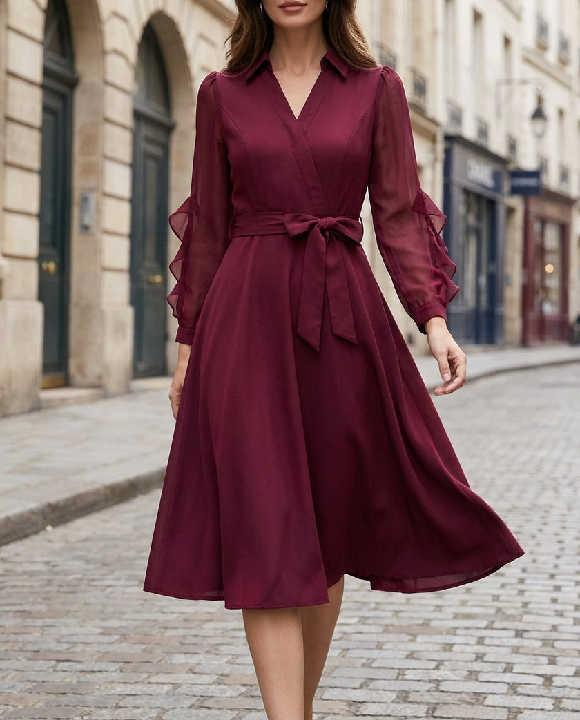 FJØRNA elegant wrap midi dress for women with sheer sleeves, showcasing a flowing silhouette and sophisticated design.