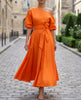 FJØRNA radiant one-shoulder midi dress with waist tie and flared skirt, stylish for women, shown from front view.