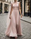 FJØRNA high-neck sleeveless evening gown with tulle overlay and long sleeves, elegant maxi dress for formal occasions.