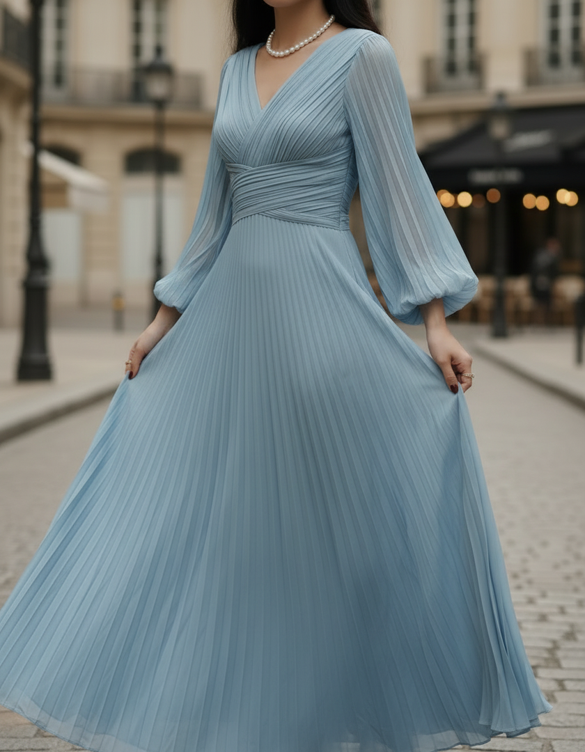 Steel blue pleated midi dress by FJØRNA featuring a flowing silhouette, pleats, and a stylish midi length perfect for elegant occasions.