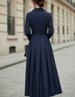 FJØRNA collared button-front midi dress with tailored pleats and belted waist, elegant and feminine for women.