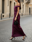 FJØRNA satin off-shoulder ruched maxi dress with long sleeves, elegant and flowy, perfect for formal occasions.