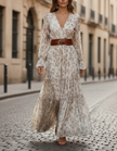 FJØRNA romantic floral chiffon maxi dress with belted waist, flowing fabric, and vibrant floral pattern.