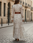FJØRNA romantic floral chiffon maxi dress with belted waist, flowing silhouette, and vibrant floral pattern perfect for elegant occasions.