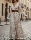 FJØRNA romantic floral chiffon maxi dress with belted waist, featuring a flowing design and vibrant floral pattern.