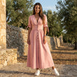 FJØRNA button front midi dress with V-neck and waist tie, featuring a flowy design and stylish details.