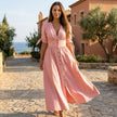 FJØRNA button front midi dress with V-neck and waist tie, featuring a flowy fabric and elegant design.