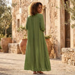 FJØRNA loose fit maxi shirt dress with long sleeves and V-neck, shown in a flowing fabric on a model.