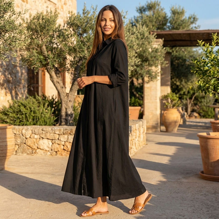 FJØRNA button front maxi shirt dress with waist tie, long sleeves, and a relaxed fit, shown hanging on a hanger.