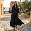 FJØRNA button front maxi shirt dress with waist tie, long sleeves, and a flowy silhouette, shown on a model.