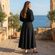 FJØRNA button front maxi shirt dress with waist tie, long sleeves, and a flowing silhouette, displayed on a model.