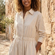 FJØRNA button front maxi shirt dress with waist tie, long sleeves, and front buttons, displayed on a hanger.