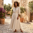 FJØRNA button front maxi shirt dress with waist tie, long sleeves, and a relaxed fit, shown on a model.