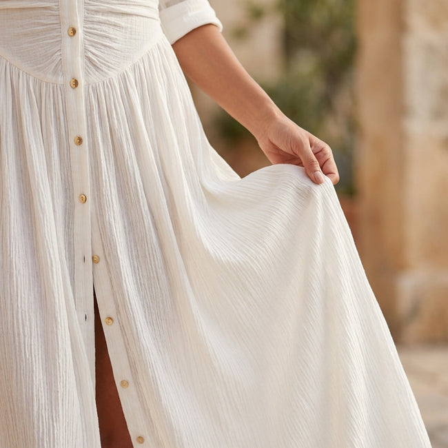 FJØRNA women's summer dress with long sleeves and slit, flowing fabric, perfect for warm weather and casual outings.